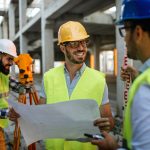 Business building teamwork people concept. Group of engineer with blueprint on construction site